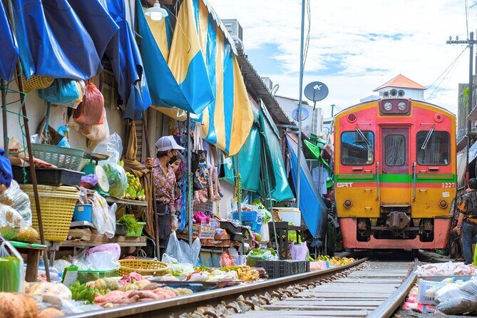 Amphawa Floating Market & Maeklong Railway Train Market Tour - Wat Bang Kung’s banyan-tree Buddhas: one hour of quiet strangeness