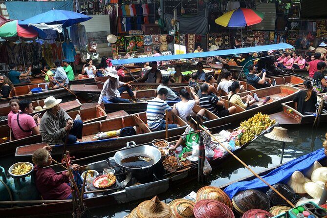 Bangkok: Floating Market and Train Tour with Guide in Spanish and English - Stop 1 and 2: Mae Klong Railway Market and the train-stall reset