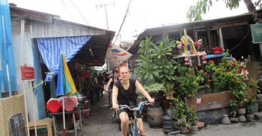 Bangkok Full-Day Bike Tour with Boat Transfer and Lunch - Under the highway: neighborhoods you only see from a bike