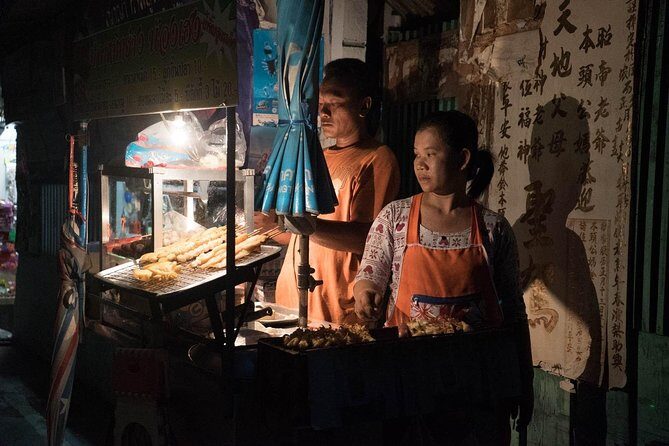 Bangkok Hidden Paths Night Biking Tour with Street-food Meal - Chao Phraya at night: temples, cooler air, and a ferry crossing
