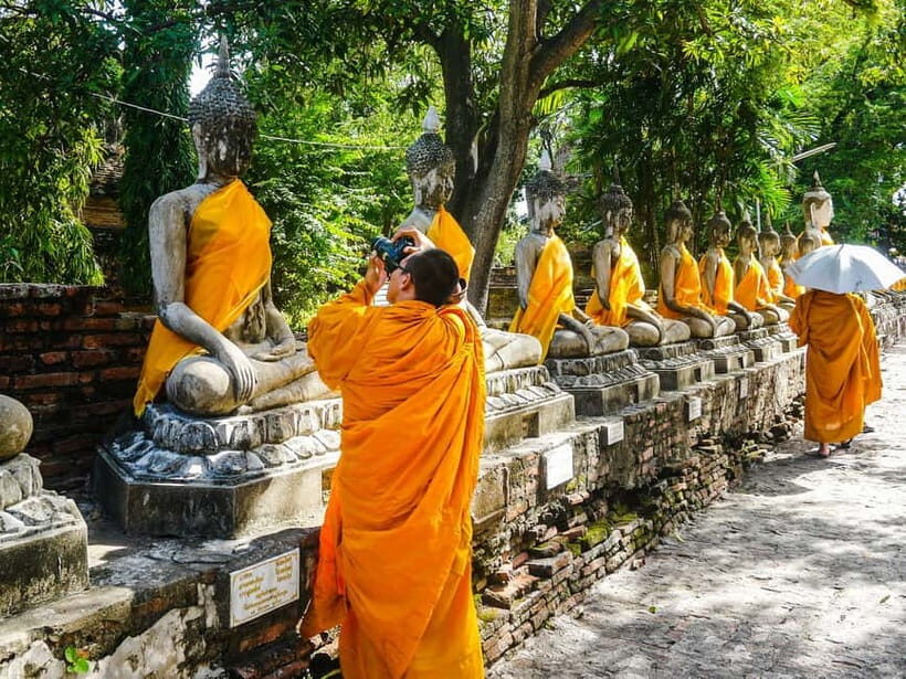 From Bangkok: Ayutthaya Heritage Tour with Sunset Boat Ride - Wat Maha That: The Tree-Root Buddha Head You Can’t Unsee