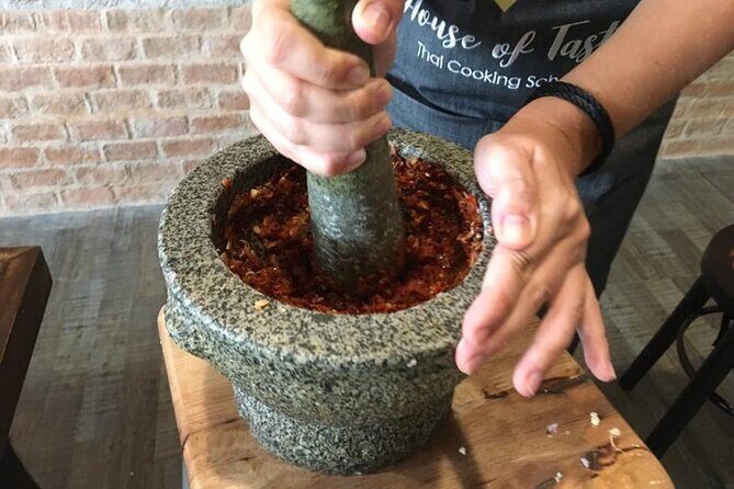 Hands-on Thai Cooking Class & Market Tour in Sukhumvit - Your Meal at the Table: Hot Food, Cold and Hot Water, and Optional Alcohol