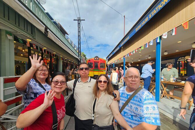 Private Floating Market, Train Market and After Rain Cafe Tour - Mae Klong Railway Market: watching the train pass through the stalls